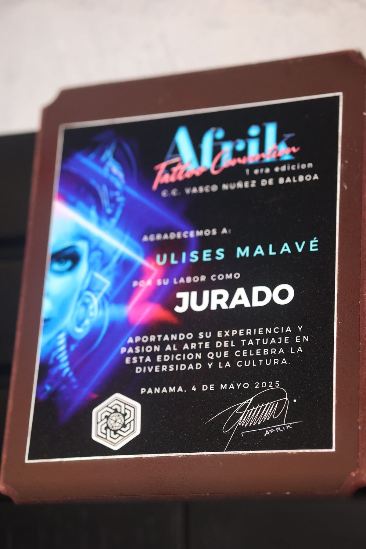 Afrik Tattoo Convention 2025 plaque thanking Ulises Malavé for judging the first edition