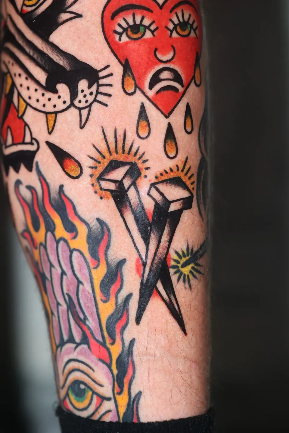 Crying heart with coffin nails and flames, color traditional tattoo by Ulises Malavé